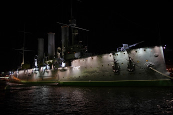 A Large Ship In The Waters Of St. Petersburg At Night.