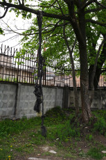 A Chain Link Fence In The Middle Of A Yard In Iļģuciems.