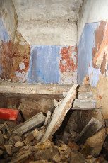 A Demolished Room In Iļģuciems Covered In Rubble.