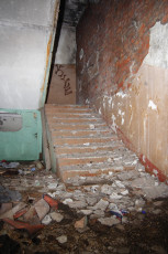 An Abandoned Building In Iļģuciems With A Stairway.