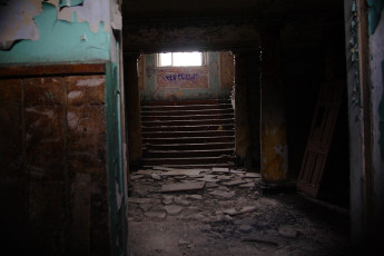A Daugavgrīva Staircase In An Old Building With A Broken Window.