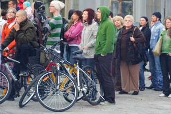 A Group Of People Standing In Front Of A Building During A Dzelzs Vilks Ielīgo '09 Event.
