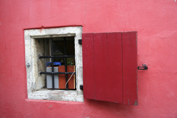 A Red Building With A Window In Tallinn.