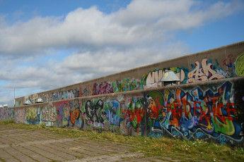 A Graffiti-Covered Concrete Wall In Tallinn.
