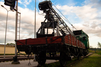A Train In A Train Museum With A Crane Attached To It.