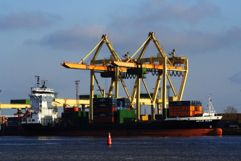 A Voleri Container Ship Docked At A Dock.