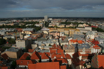 Riga From Above: A View Of A Cityscape From The Top Of A Building.