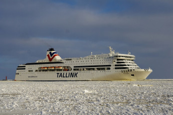 A Large Cruise Ship Navigating Through The Icy Waters Of Daugavgrīva During Winter.