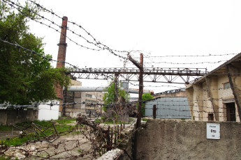 A Iļģuciems Fence With Barbed Wire.
