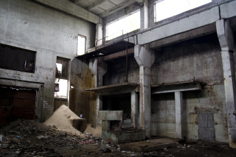 The Inside Of An Iļģuciems Building With A Lot Of Rubble.