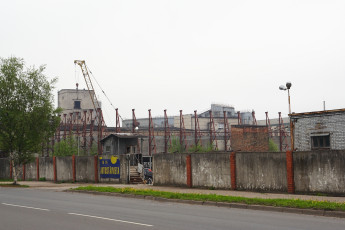 A Crane In Front Of A Building In Iļģuciems.
