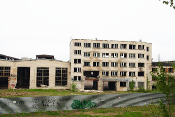 A Graffitied Building In Iļģuciems.