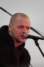 A Man Singing Into A Microphone At The Dzelzs Vilks Ielīgo '09 Music Festival.