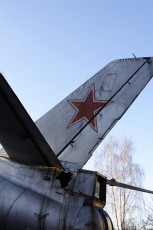 A Silver Airplane With A Red Star On The Tail, Identified As A Skulte.