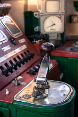 A Train Museum Control Panel With Red And Green Lights.